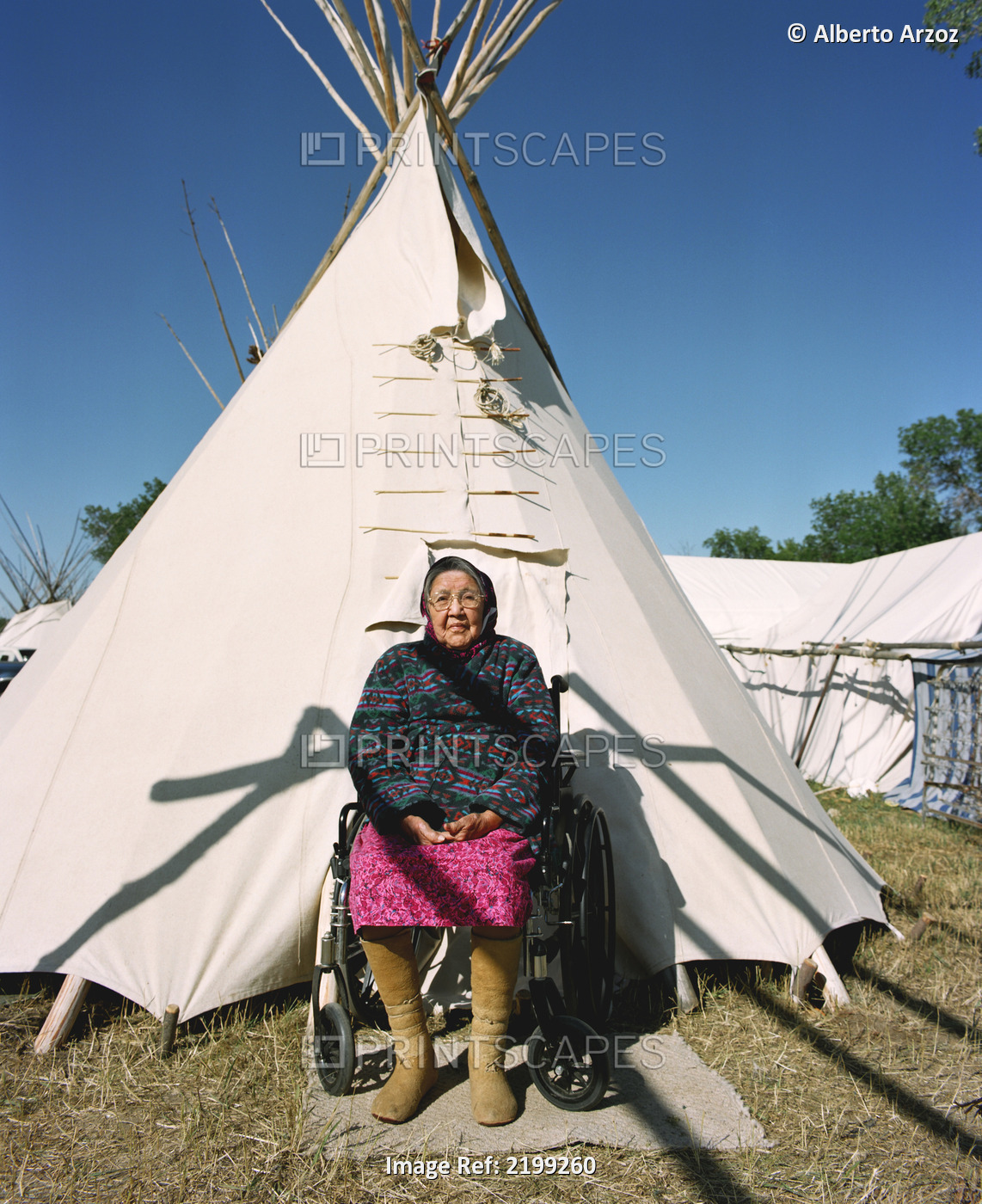 Elderly Crow Woman Dressed In Traditional Garment In Front Of Her Family Tepee ...