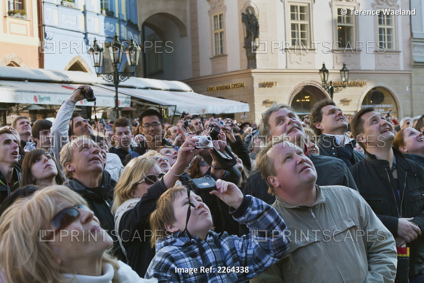 Czech Republic, Group of tourist photographing and looking up; Prague