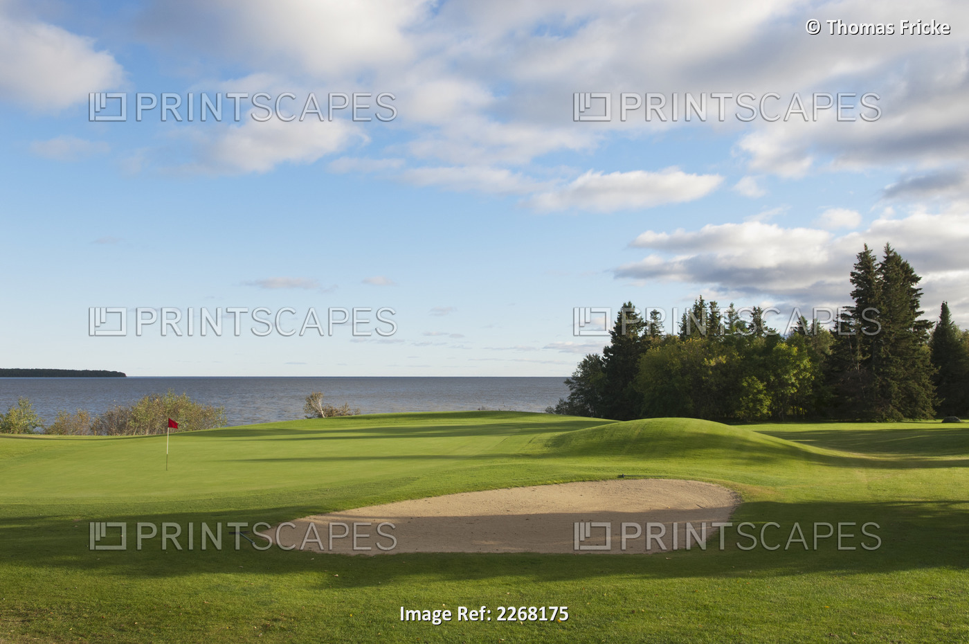 Golf course putting green and pin on lake; hecla island manitoba canada