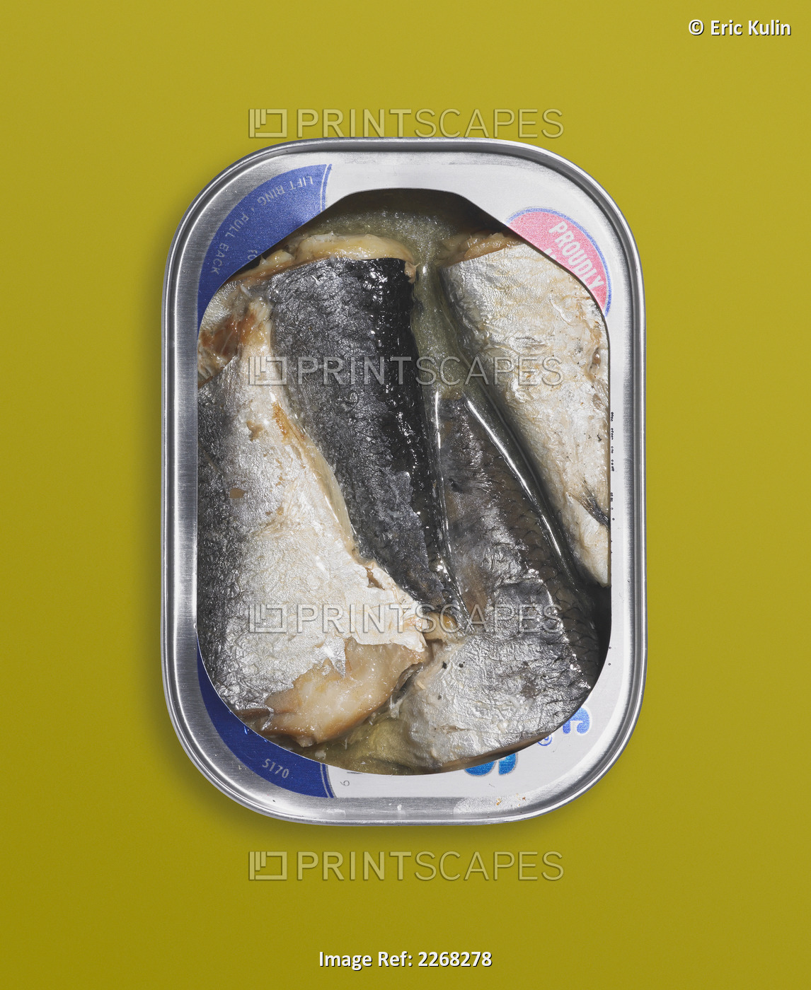 Canned herring on a yellow background