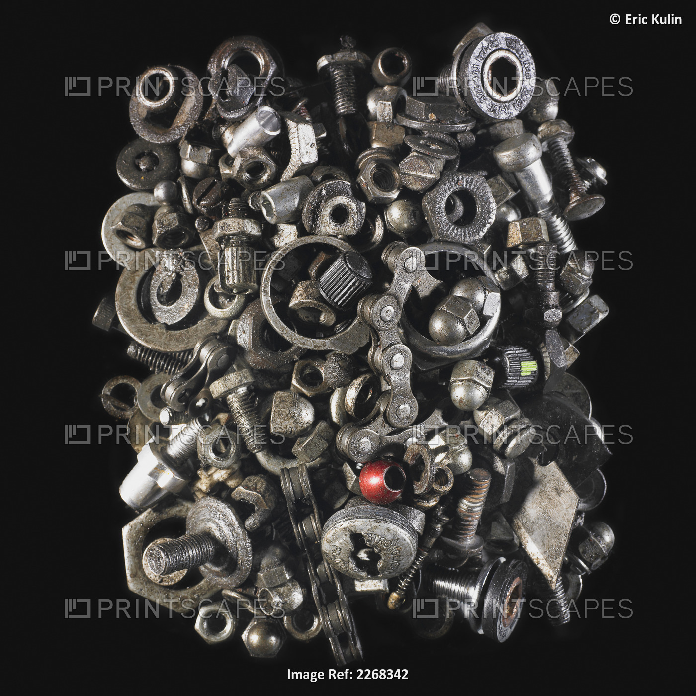 Pile of nuts and bolts on a black background