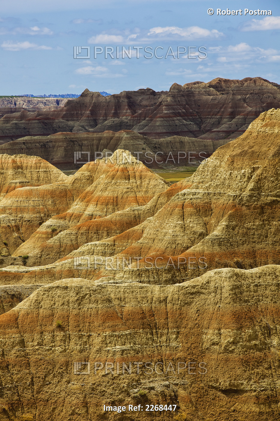 Light hitting the various areas of eroded formations in badlands national park; ...