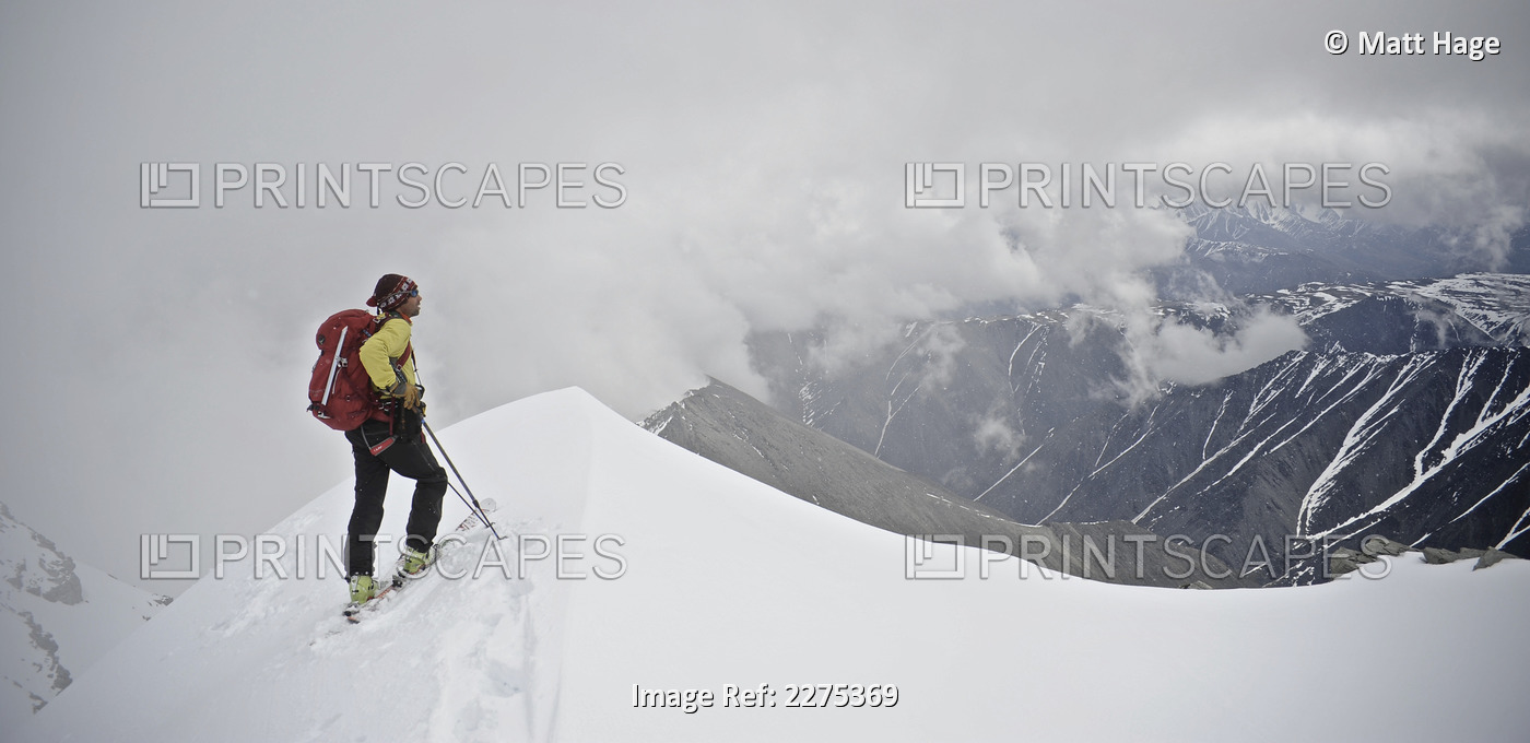 Man Skiing The North Ridge From The Summit Of Mt. Chamberlin In The Brooks ...