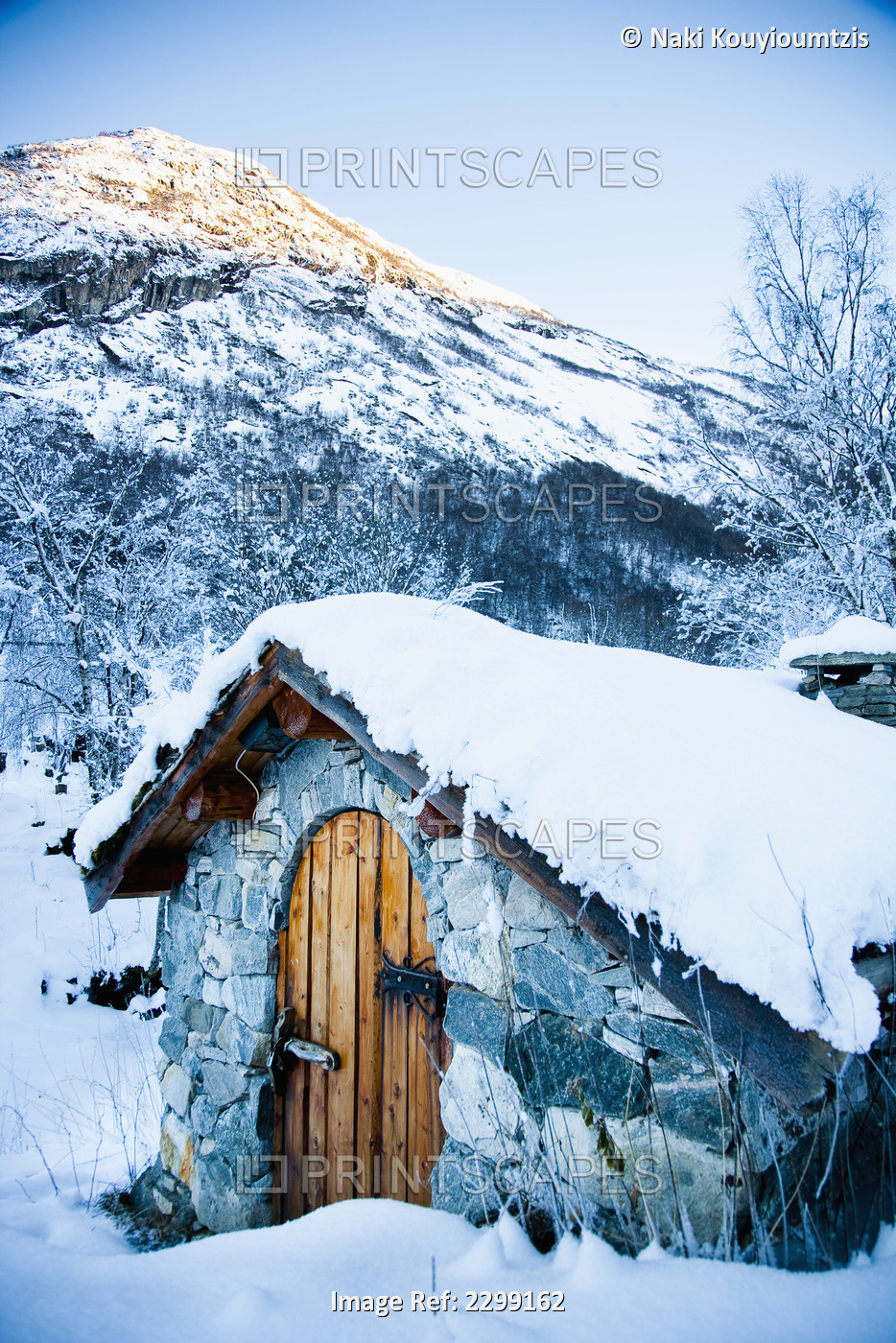 Norway, Sognefjord, snow covered traditional stone building which houses hydro ...