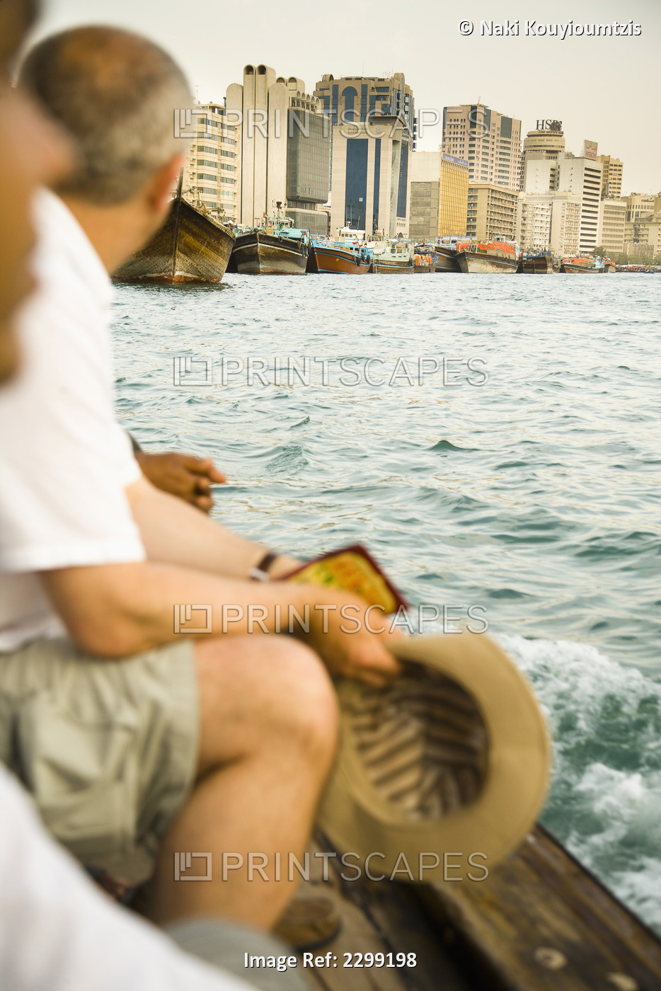 UAE, Tourists riding small ferry on Dubai Creek; Dubai