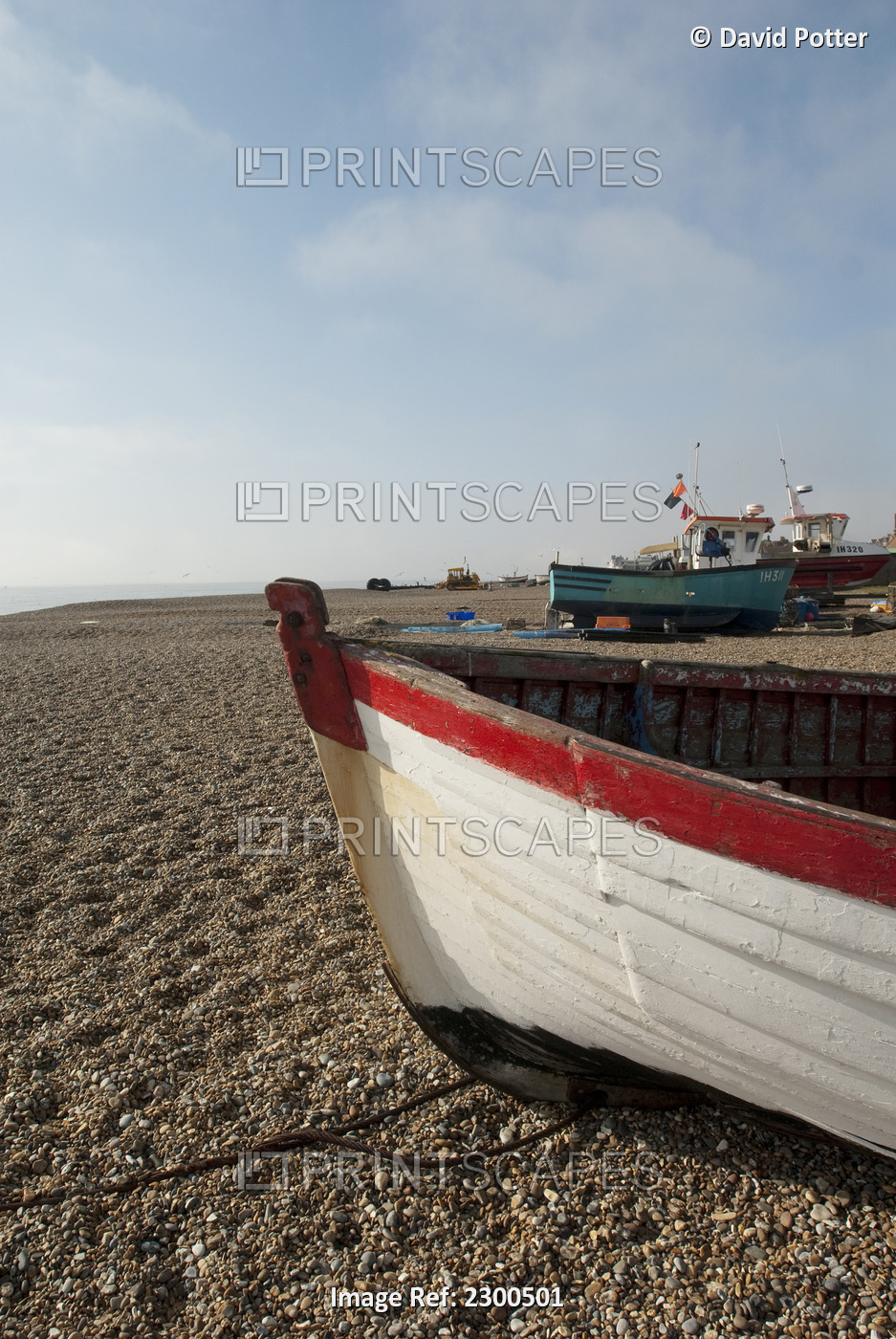 Fishing Boats Pulled To Shore On Aldeburgh Beach, Suffolk, Uk