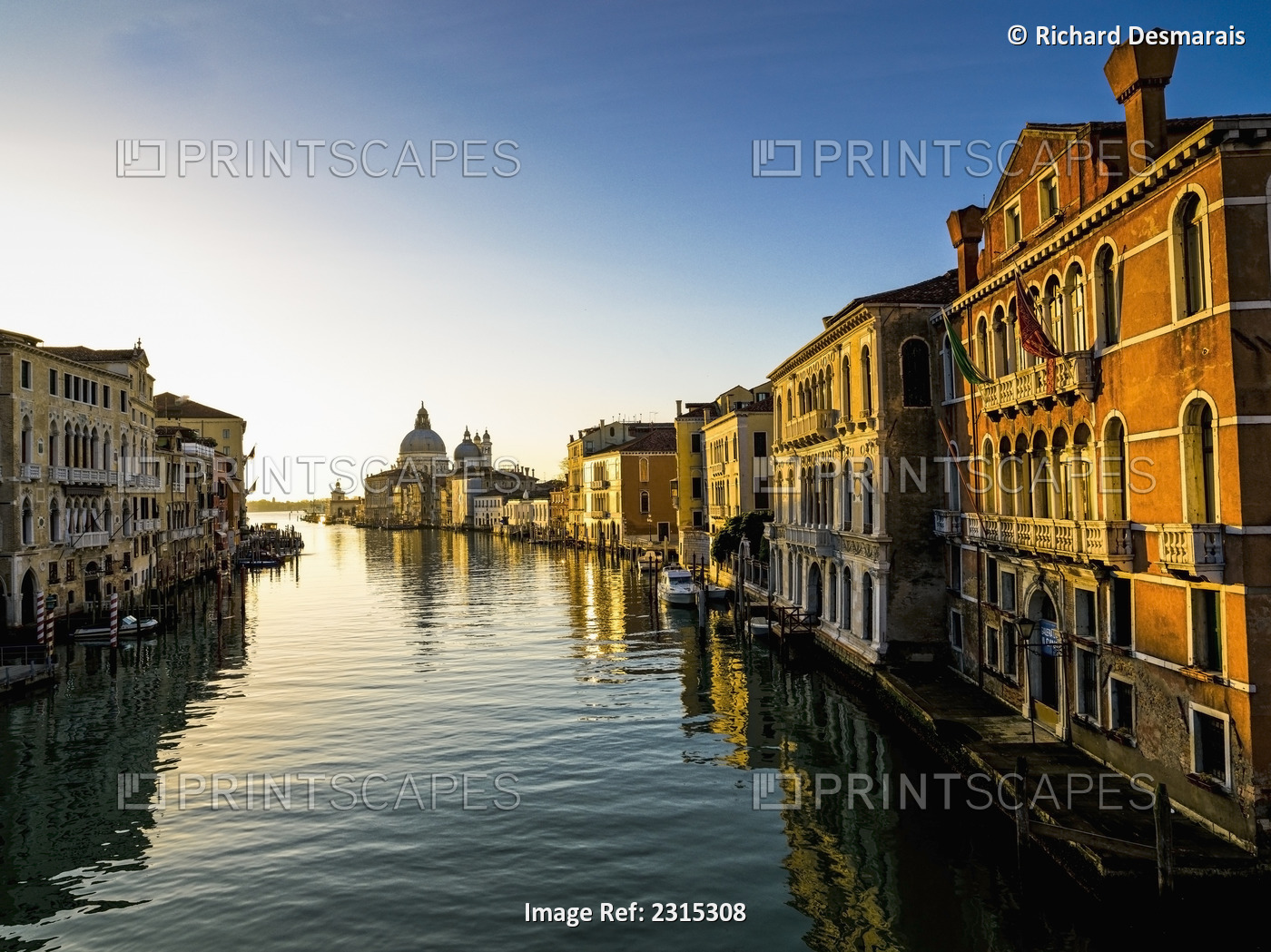 Italy, Venice, Buildings along canal at sunset