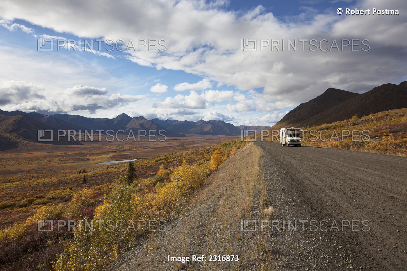 A Recreational Vehicle Drives On Dempster Highway Past Klondike Valley In ...
