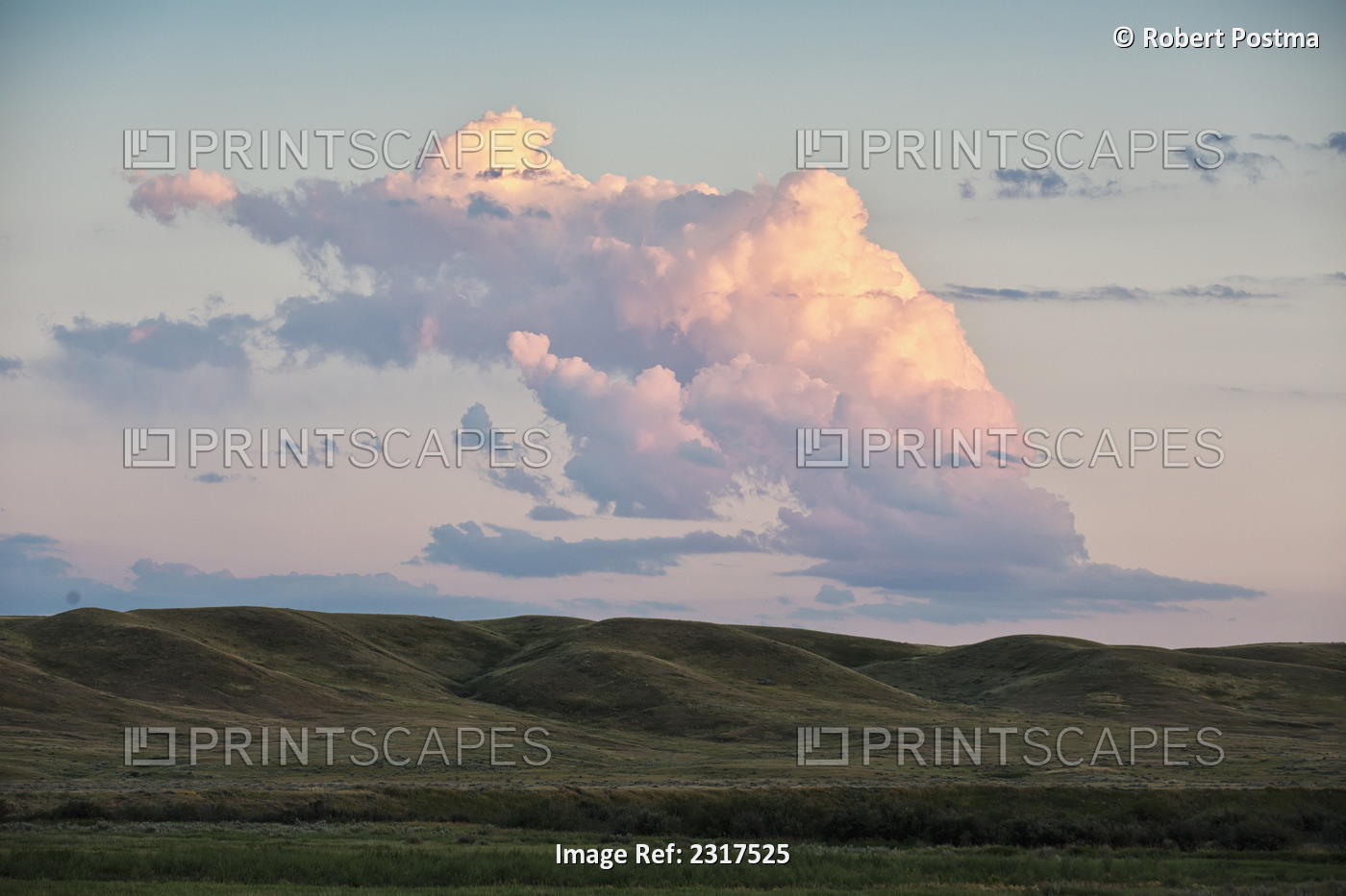 Small cumulonimbus cloud over grasslands national park; Saskatchewan canada