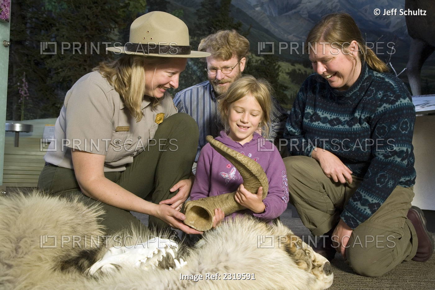 Female Us Interpretive Ranger Shows Animal Fur And Horn To A Visiting Family At ...
