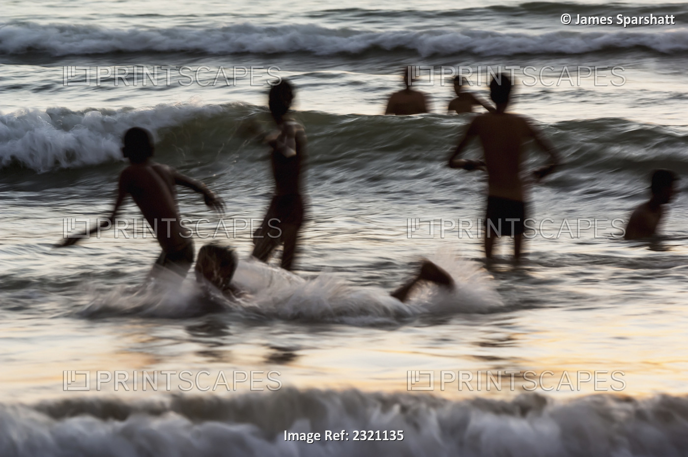 India, Karnataka, Blurry Figures In Crashing Waves At Gokarna Beach; Gokarna