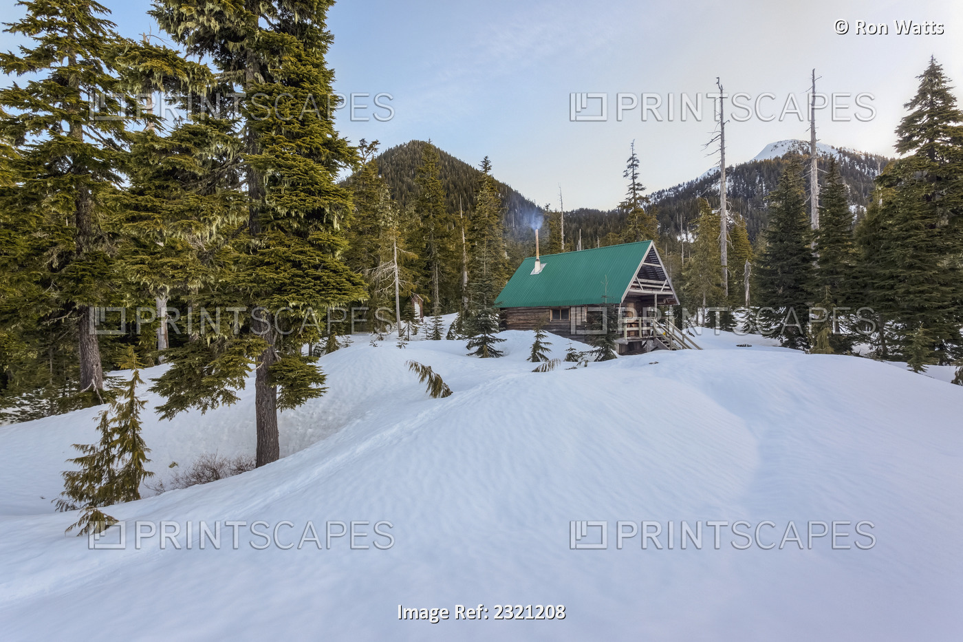The Morning Sun Illuminates Edwards Lake Cabin In Tetrahedron Provincial Park; ...