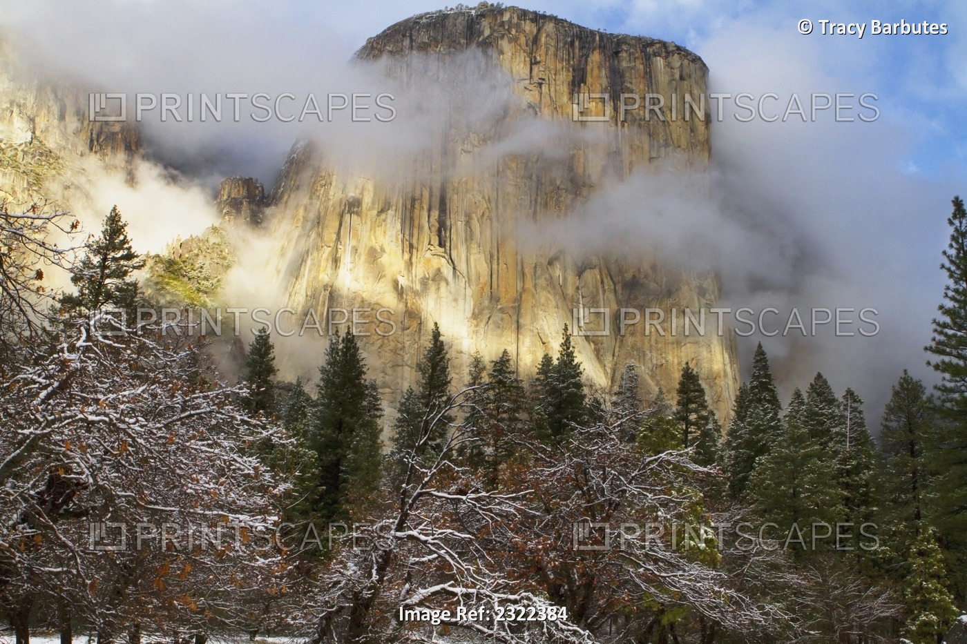 Yosemite national park's el capitan (el cap) peaks through winter storm clouds ...