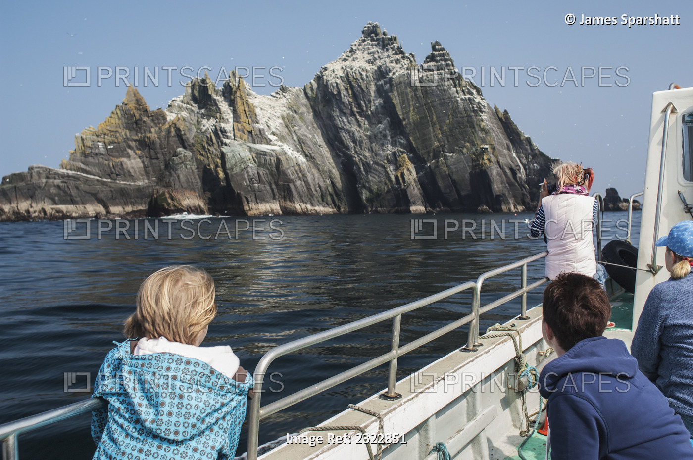 Tourists on boat close to Little Skellig; Skellig Islands, County Kerry, ...