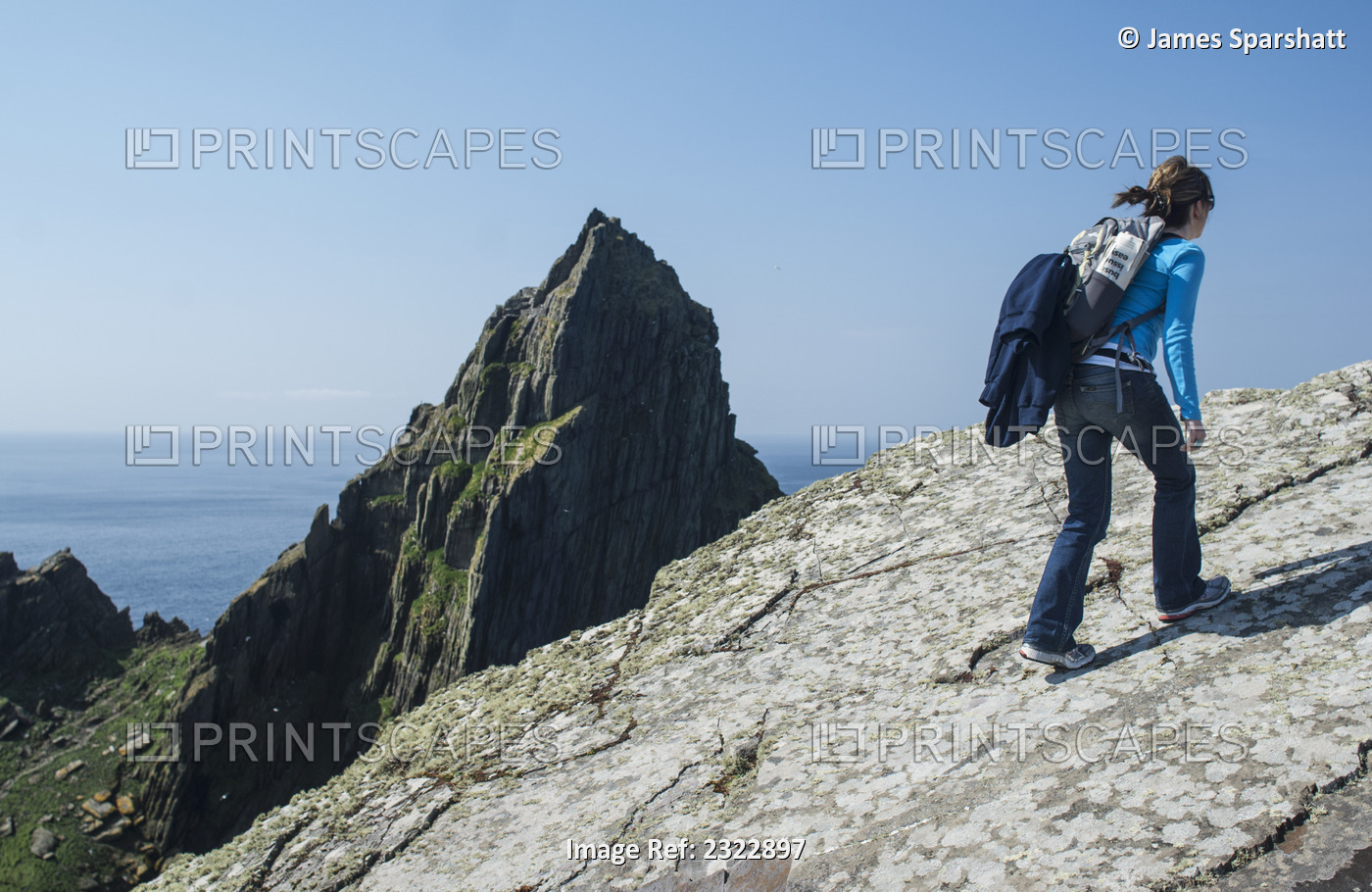 Tourist on top of Skellig Michael; Skellig Islands, County Kerry, Ireland, UK