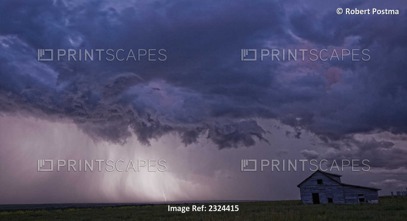 Lightning Strikes Over The Prairies As It Approaches An Old Abandoned Farm ...
