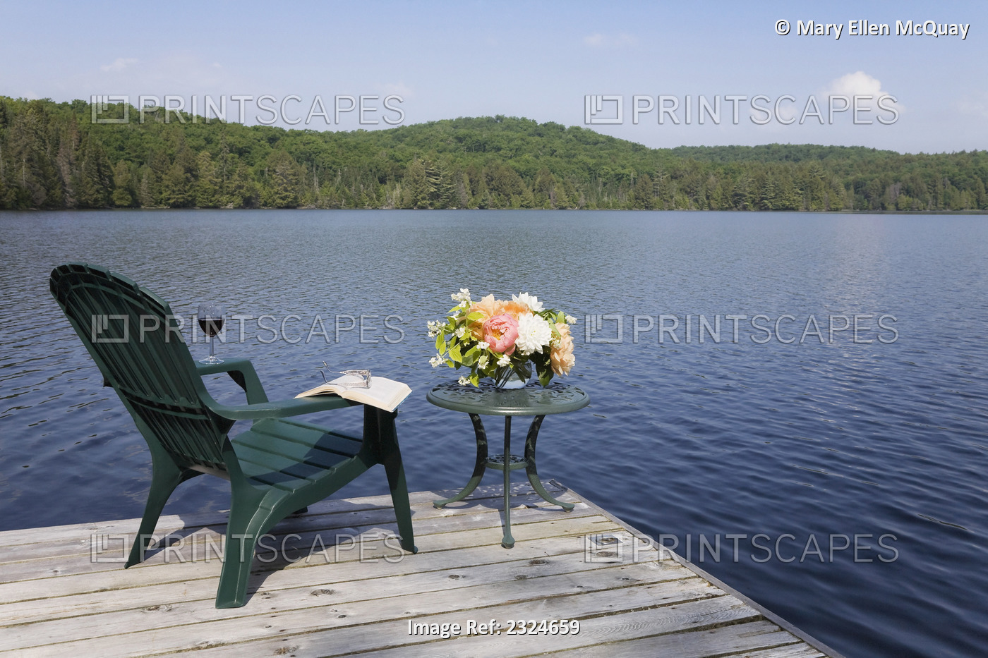 Bouquet Of Flowers With Wine, Book And Chair On A Cottage Dock, Ontario, Canada