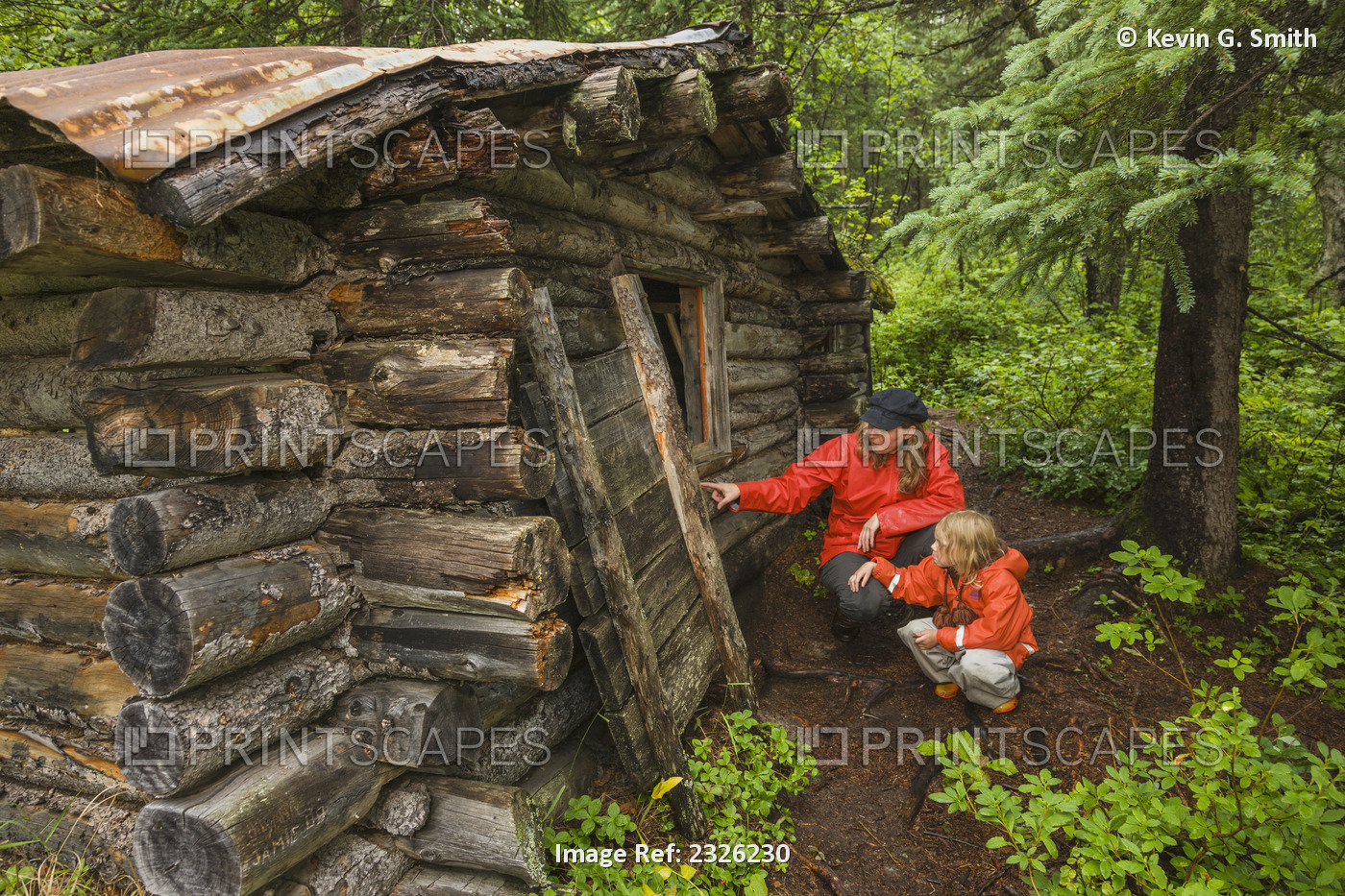 Woman, 40, And Her 5 Year Old Daughter, Both Caucasian,Inspecting A Cabin Built ...