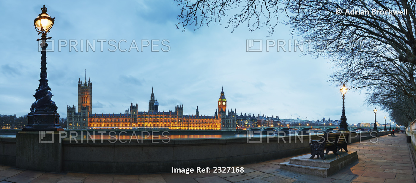 UK, Panoramic view of Houses of Parliament at dusk from River Thames; London