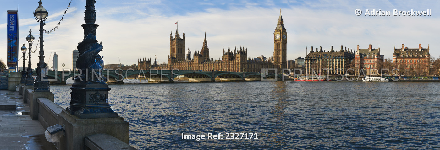 UK, Panoramic view of Houses of Parliament from bank of River Thames; London