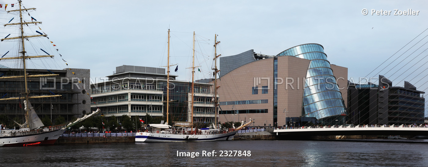 The samuel beckett bridge over the river lee and ships in the river for the ...