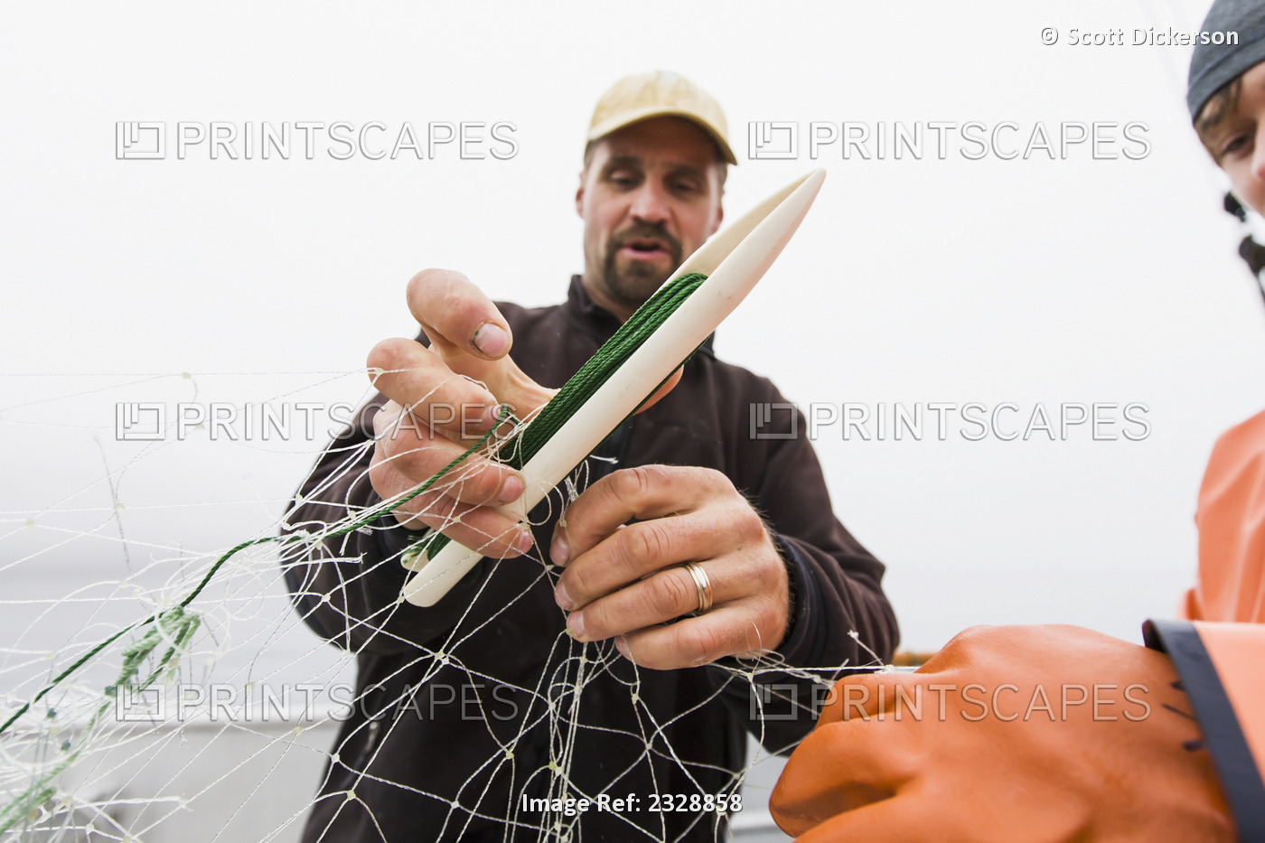Buck Laukitis And Keith Bell Repair A Tear In Their Gillnet While Commercial ...