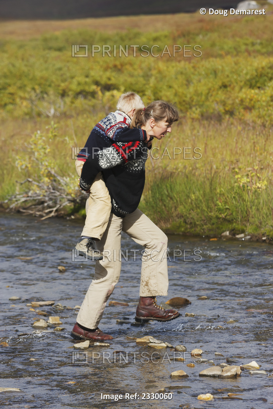 Mom Carries Boy Across Hot Springs Creek To Begin A Hike Near Serpentine Hot ...