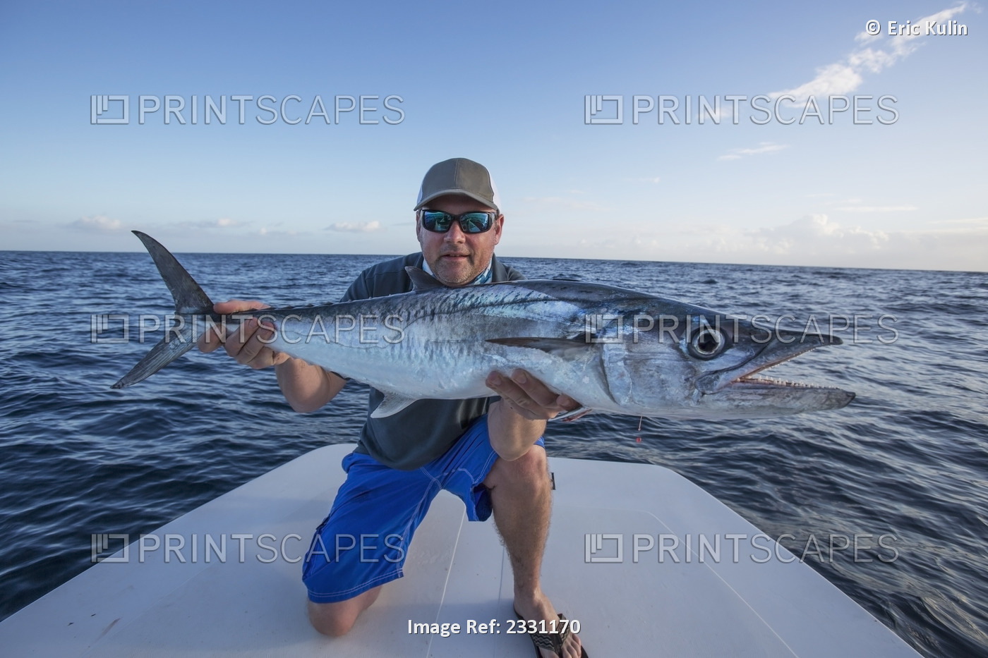 Man holding a large fresh caught fish; Puerto rico