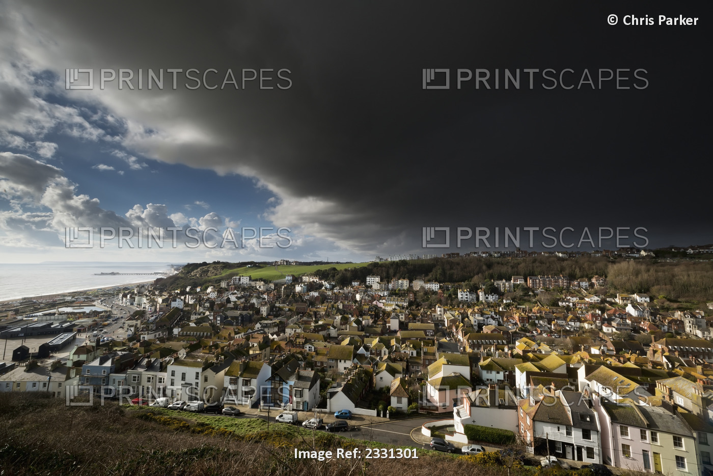 England, East Sussex, Thunderstorm over coastal resort town; Hastings