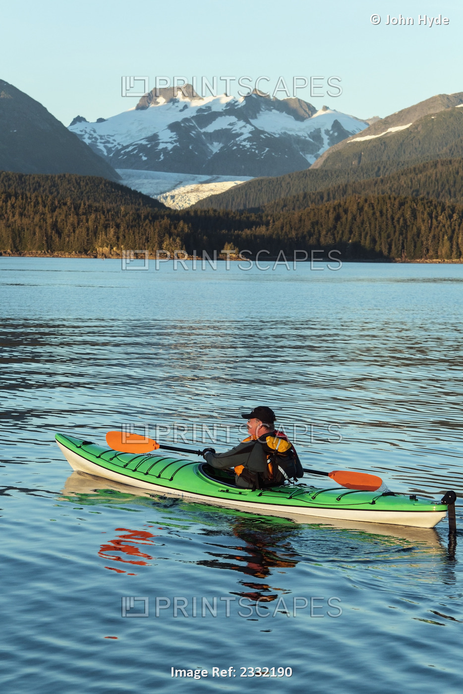 A Kayaker Paddles In Favorite Passage On An Calm Evening As The Sun Begins To ...