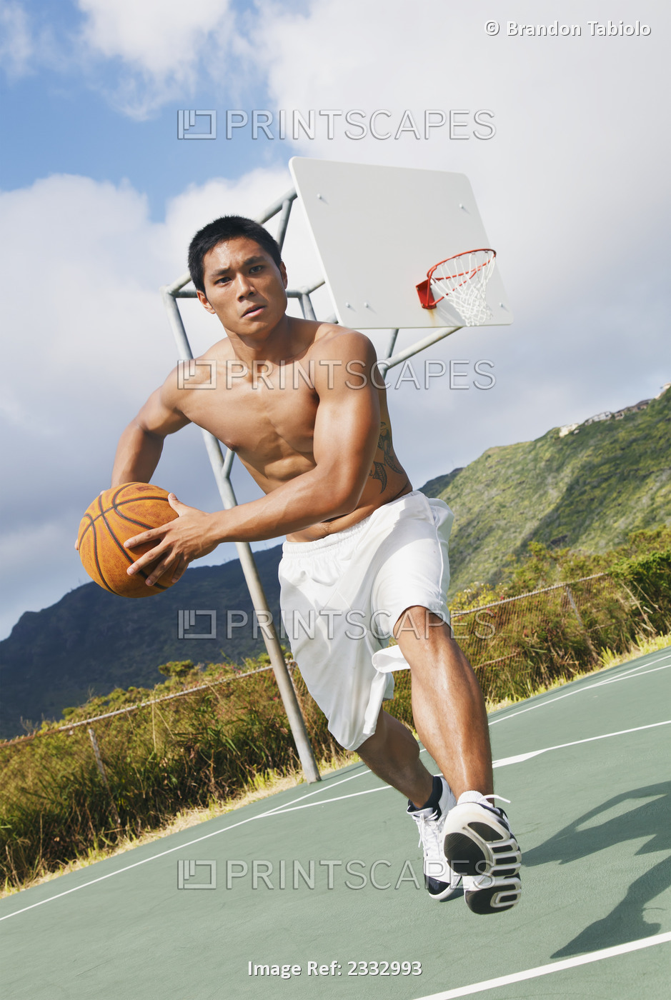 A Man Playing Basketball; Oahu, Hawaii, United States Of America