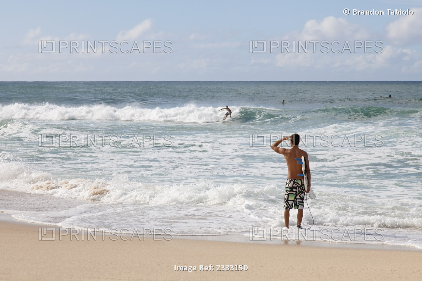 A Young Surfer Checks Out The Incoming Waves; Oahu, Hawaii, United States Of ...