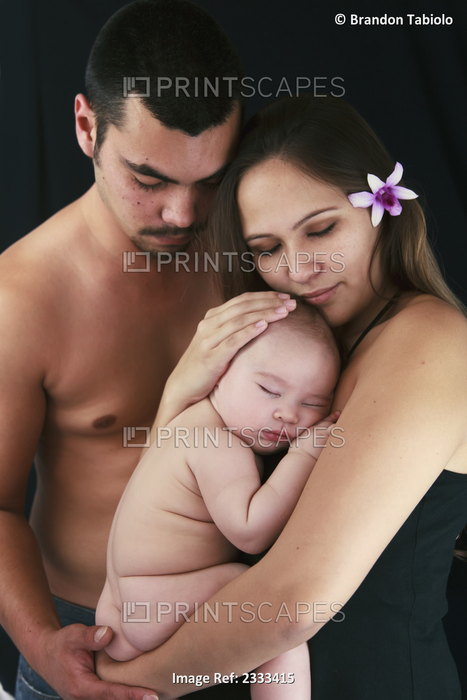 A mother and father with their baby; Honolulu hawaii united states of america