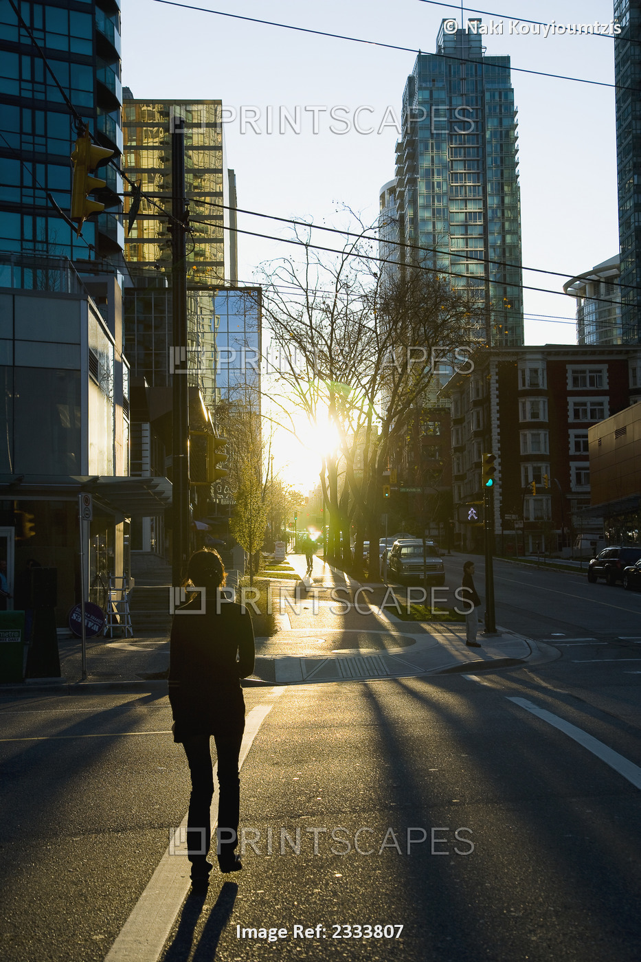 Person Crossing Street During Sunset, Downtown; Vancouver, British Columbia, ...