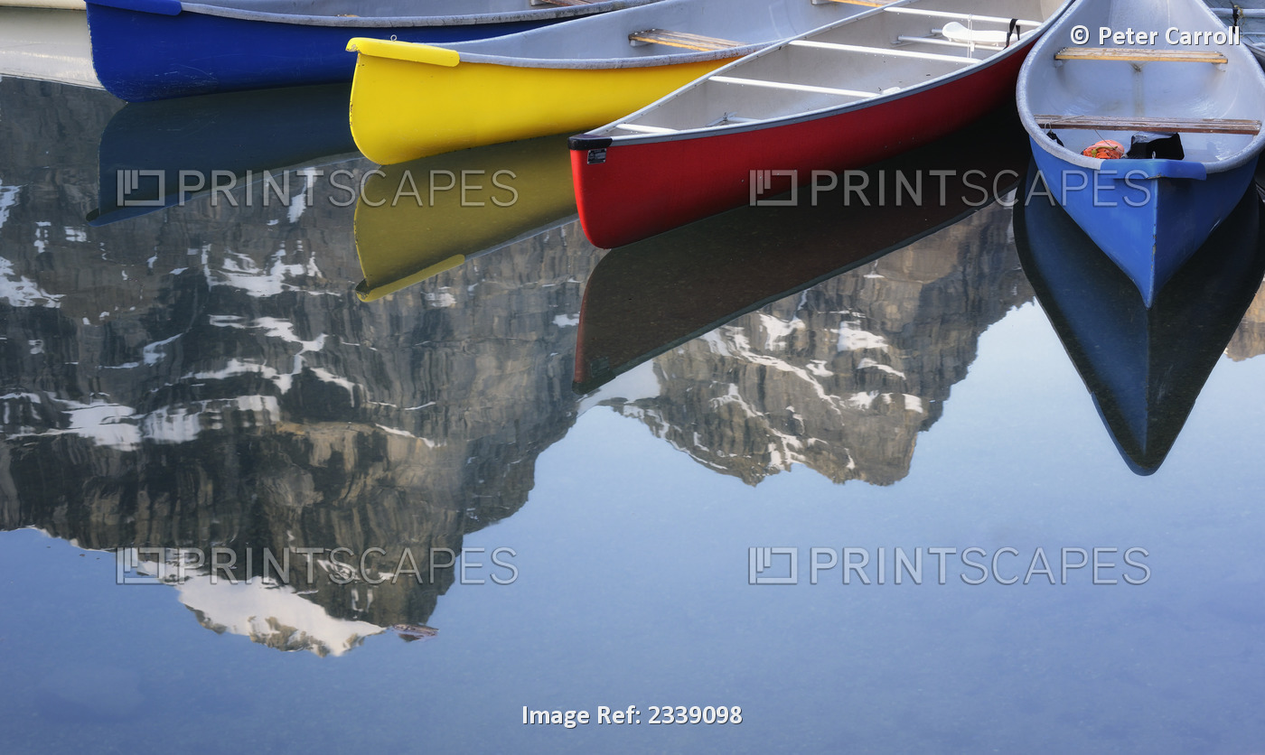 Colorful Canoes At Moraine Lake; Banff, Alberta, Canada