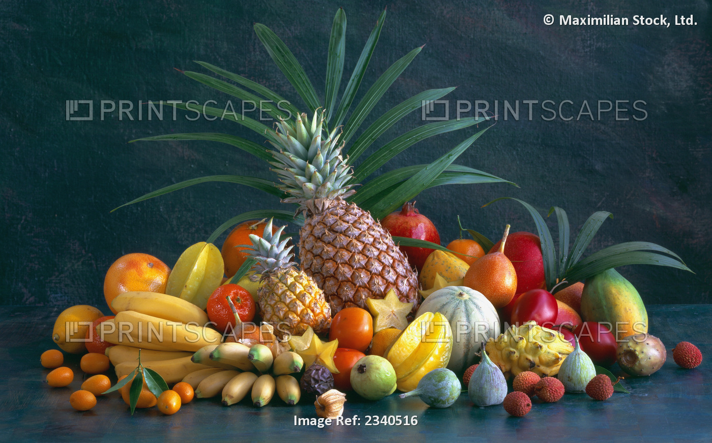 Agriculture - Assortment of tropical fruits on a dark background: pineapple, ...