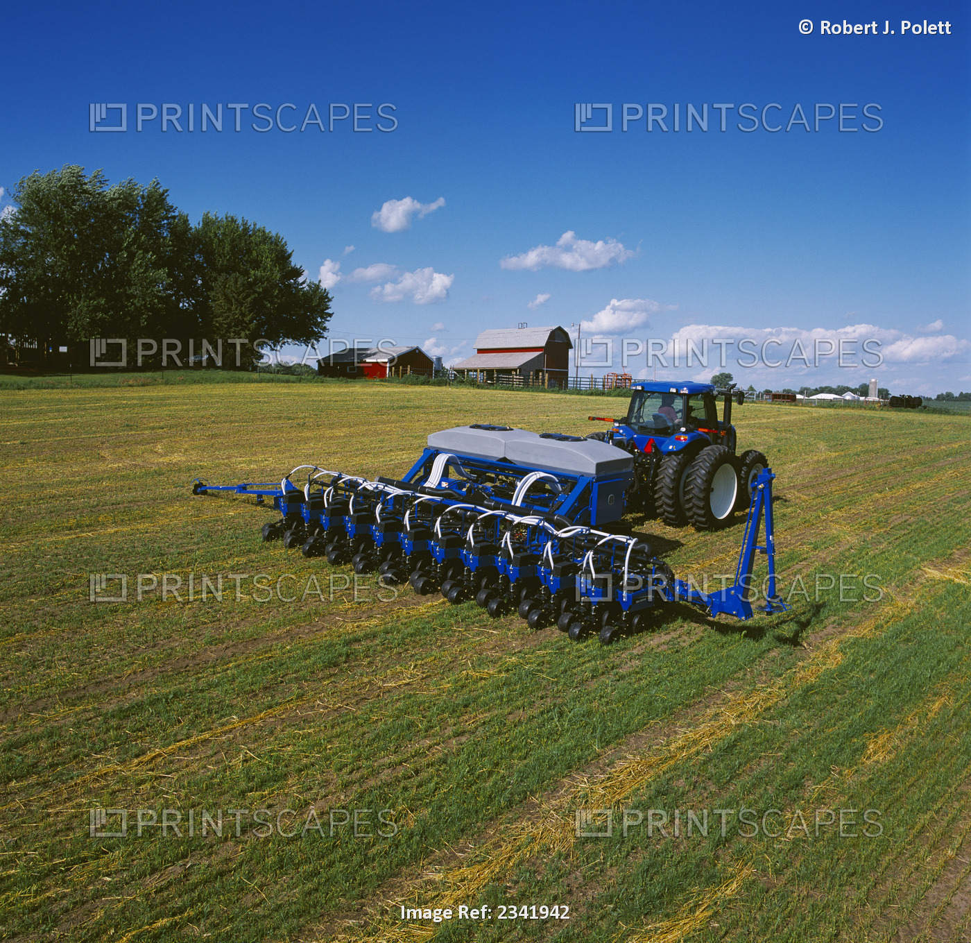 Agriculture - New Holland tractor with air seeder drilling (planting) no-till ...