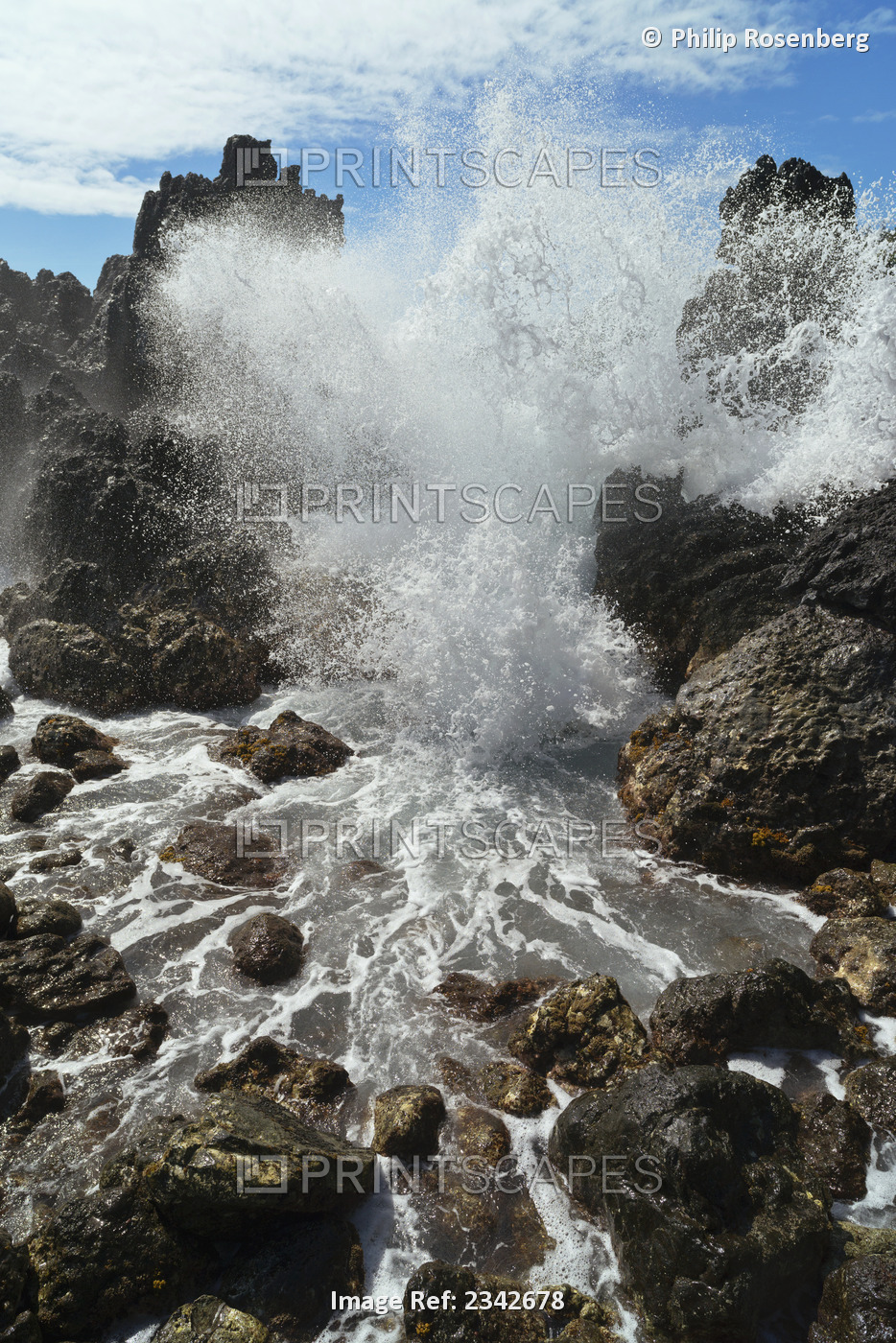 A wave crashing and splashing against rocks; Lapahoehoe hamakua hawaii united ...