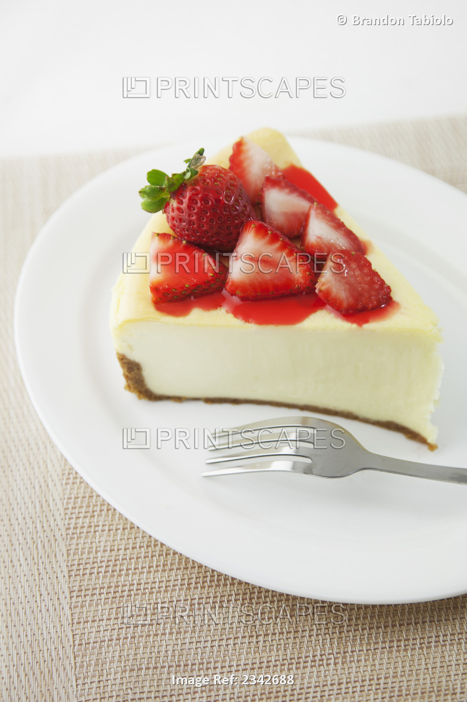 Cheesecake topped with strawberries; Oahu hawaii united states of america