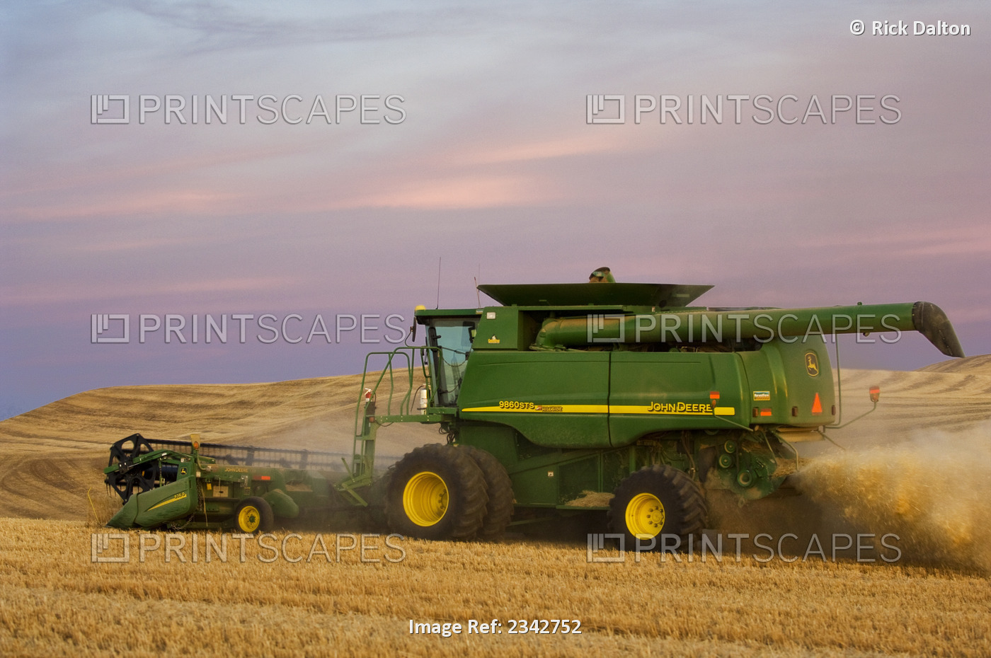 Agriculture - A John Deere combine harvests Soft White wheat on rolling ...