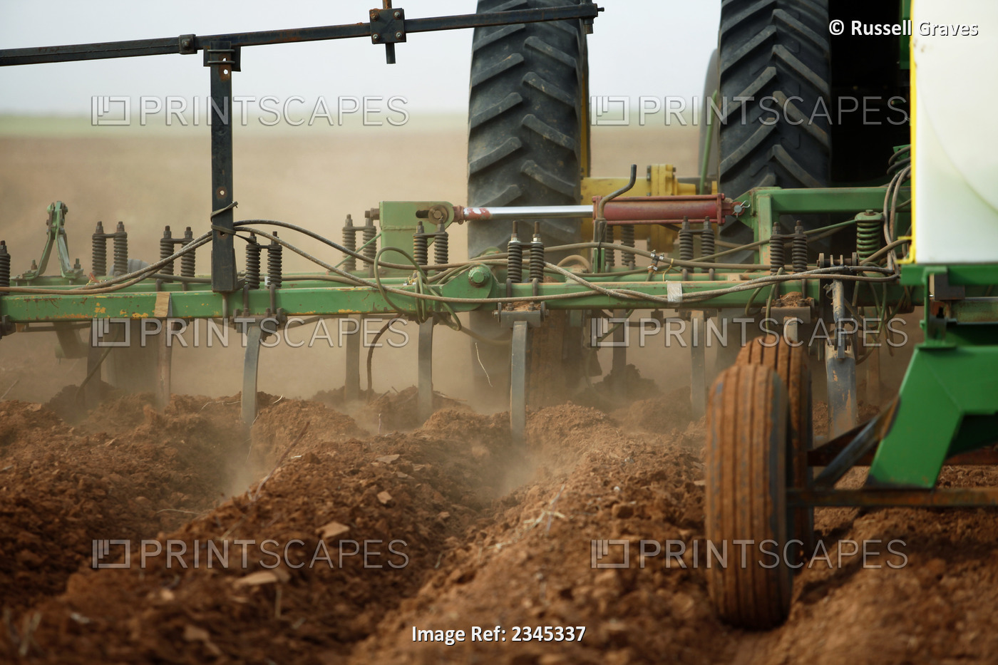 Agriculture - Closeup of a field implement preparing a field for planting ...