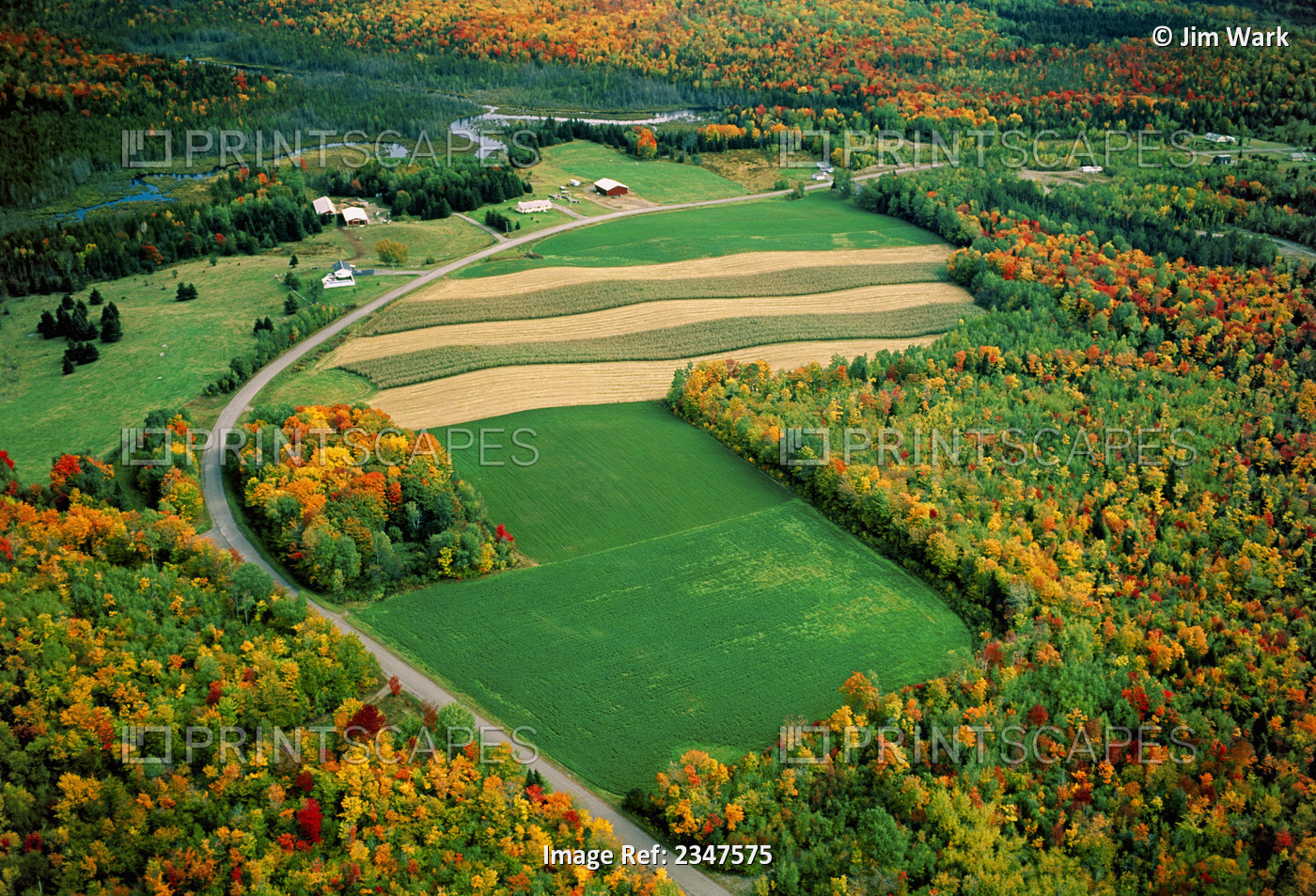Agriculture - Aerial view of agricultural fields and a farmstead surrounded by ...