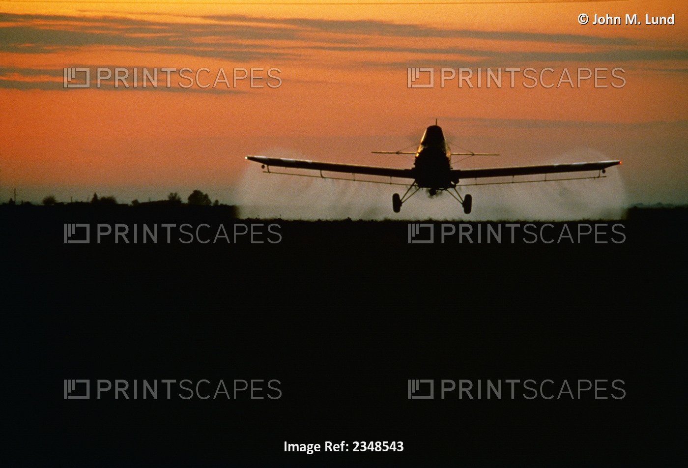 Agriculture - Crop Dusting, Fixed single wing aircraft, sunset / San Joaquin ...