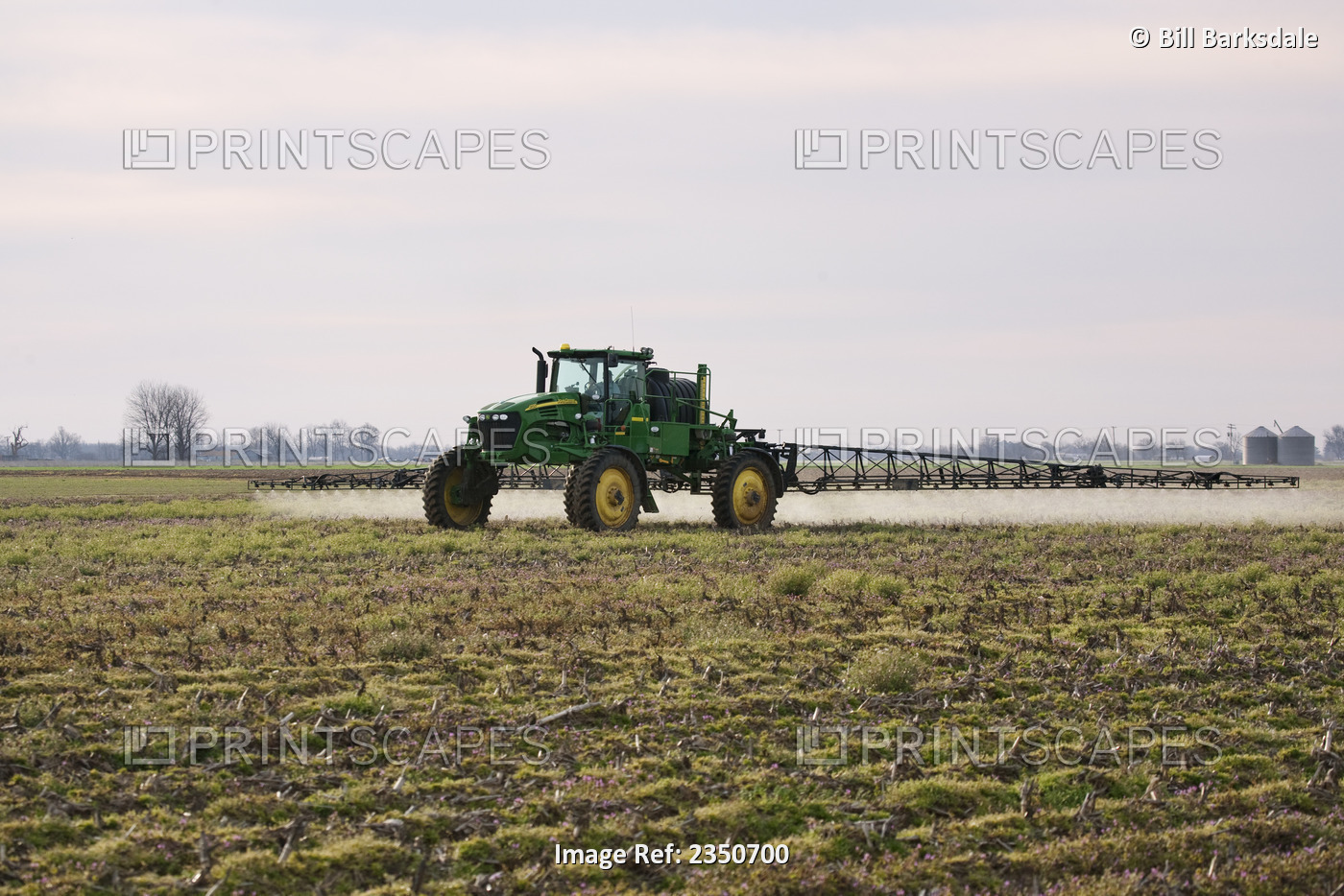Agriculture - A John Deere sprayer applies pre-plant burndown herbicide in late ...