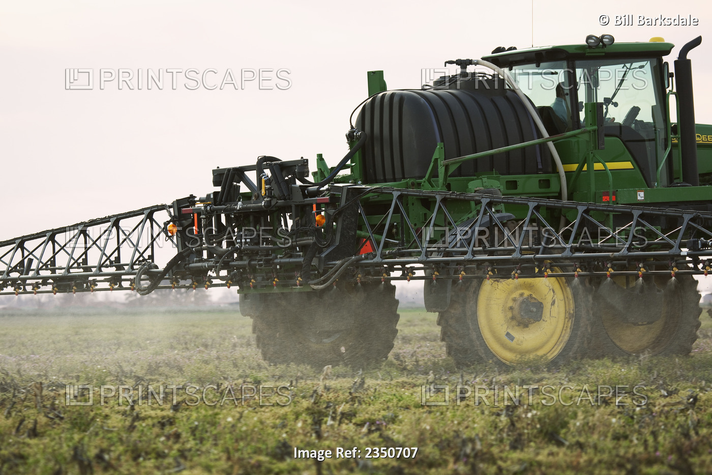 Agriculture - A John Deere sprayer applies pre-plant burndown herbicide in late ...