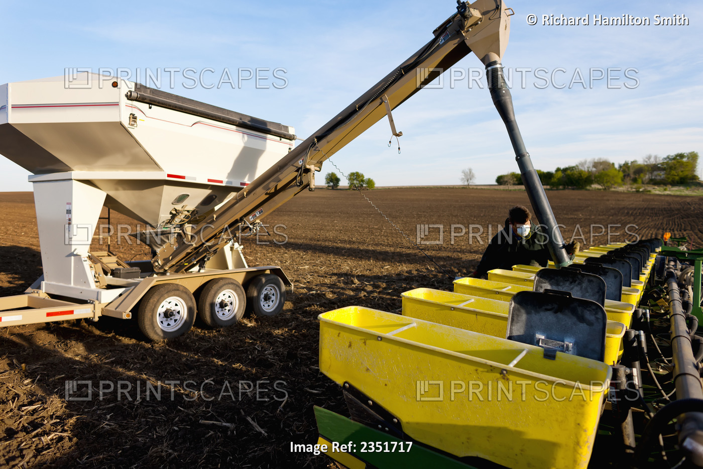 Agriculture - A farmer prepares for corn planting operations by loading his ...