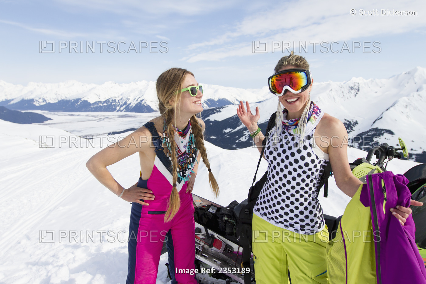Women Hanging Out On A Sunny Day While Backcountry Skiing By Snowmobile In The ...