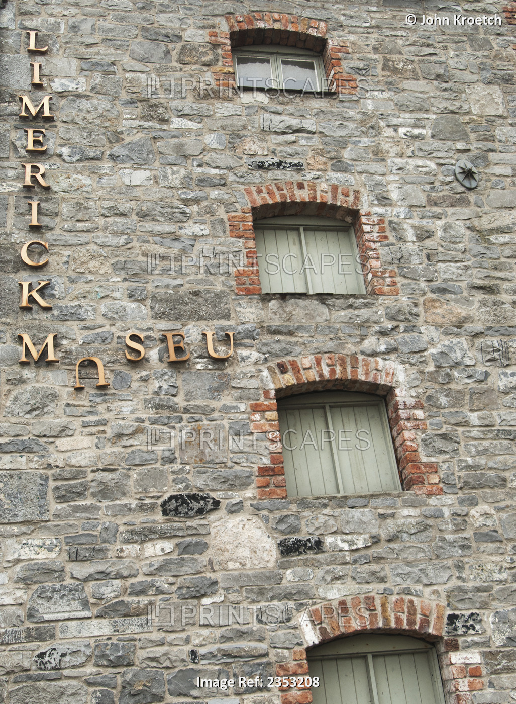 Broken Sign For Limerick Museum On The Side Of A Stone Building; Limerick, ...
