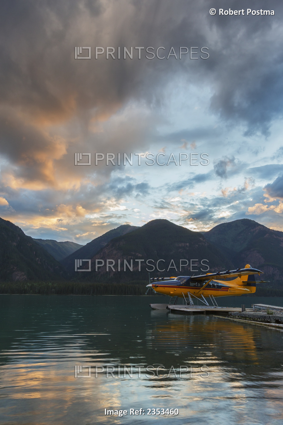 A Float Plane On Muncho Lake At Sunset; British Columbia, Canada