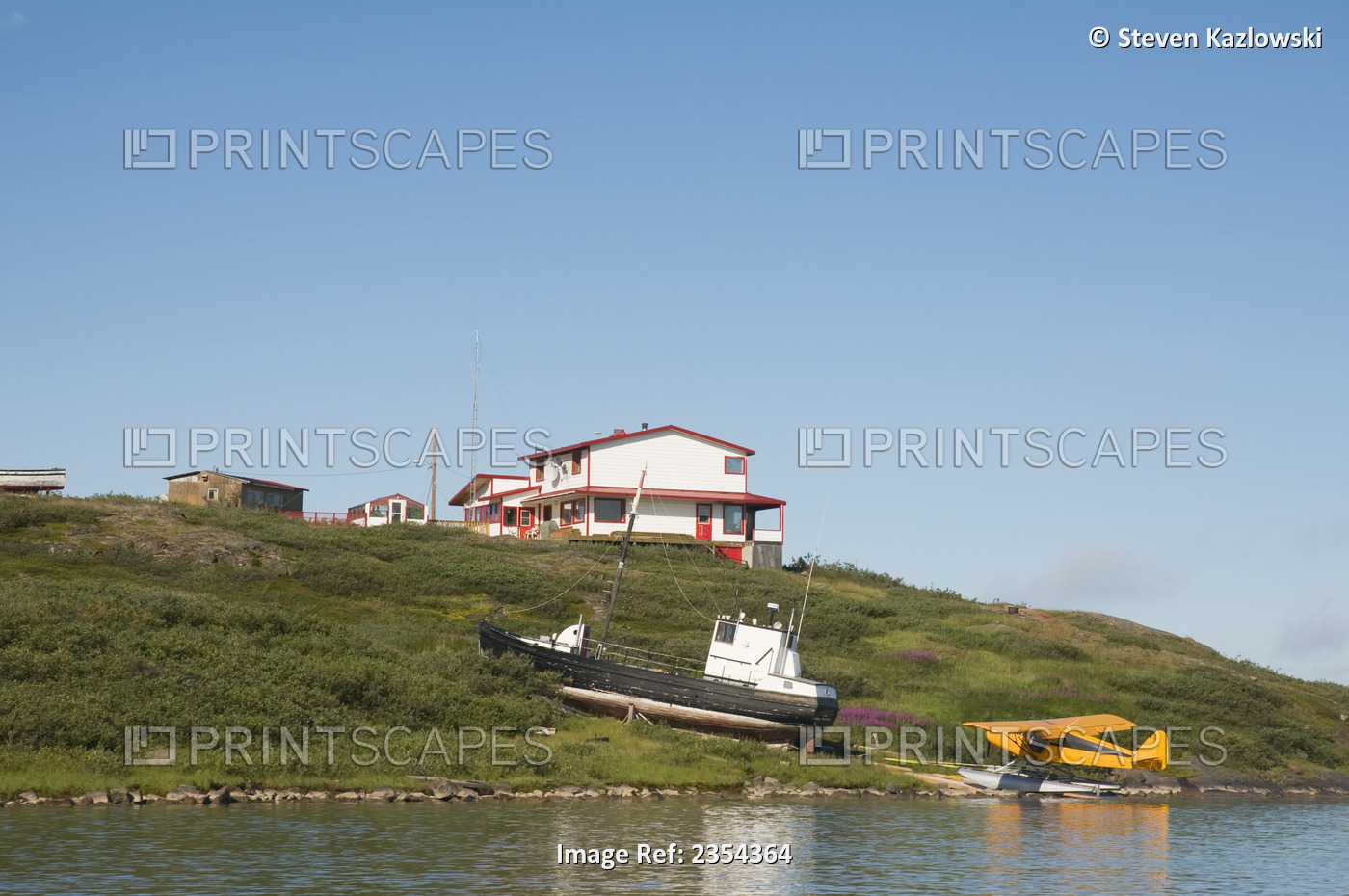 Home, Fishing Boat And Seaplane Along The Coppermine River In Arctic Hamlet; ...
